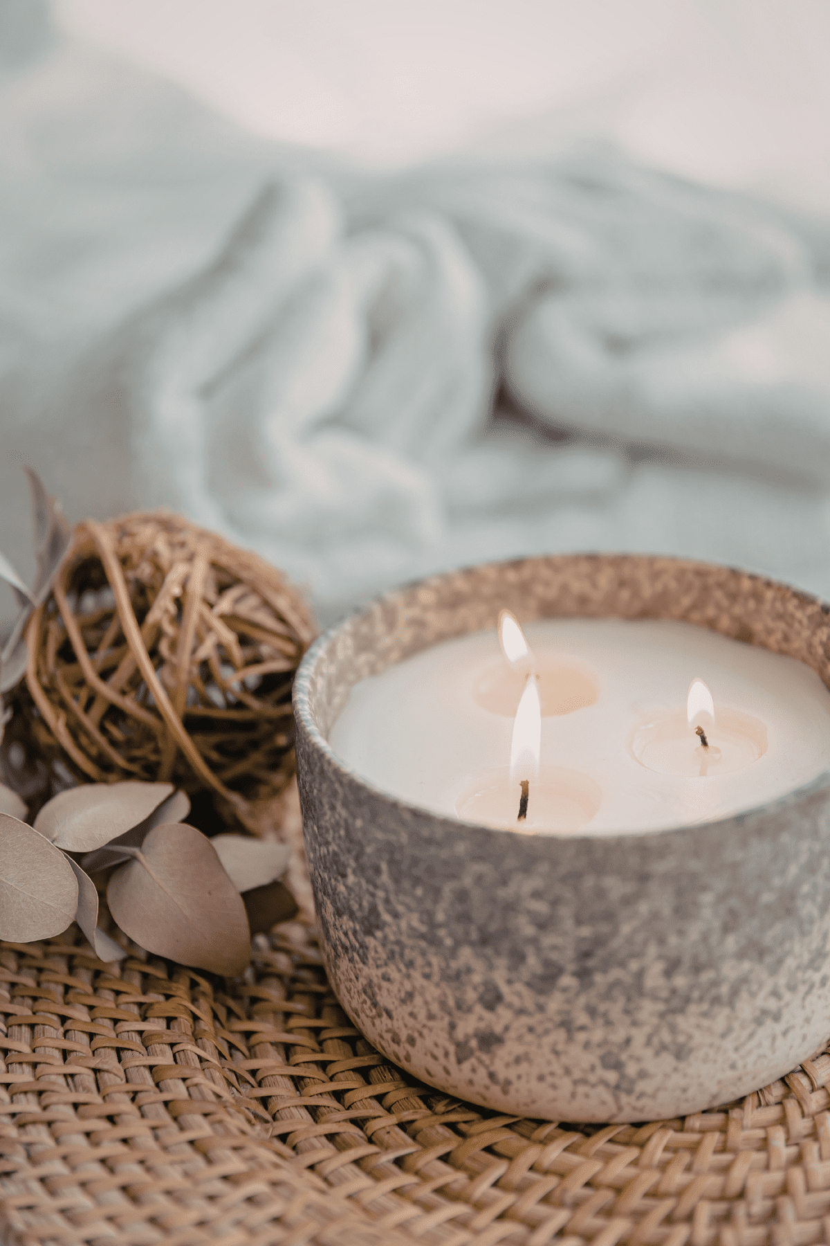 Candle with a blue blanket, creating a space for healing