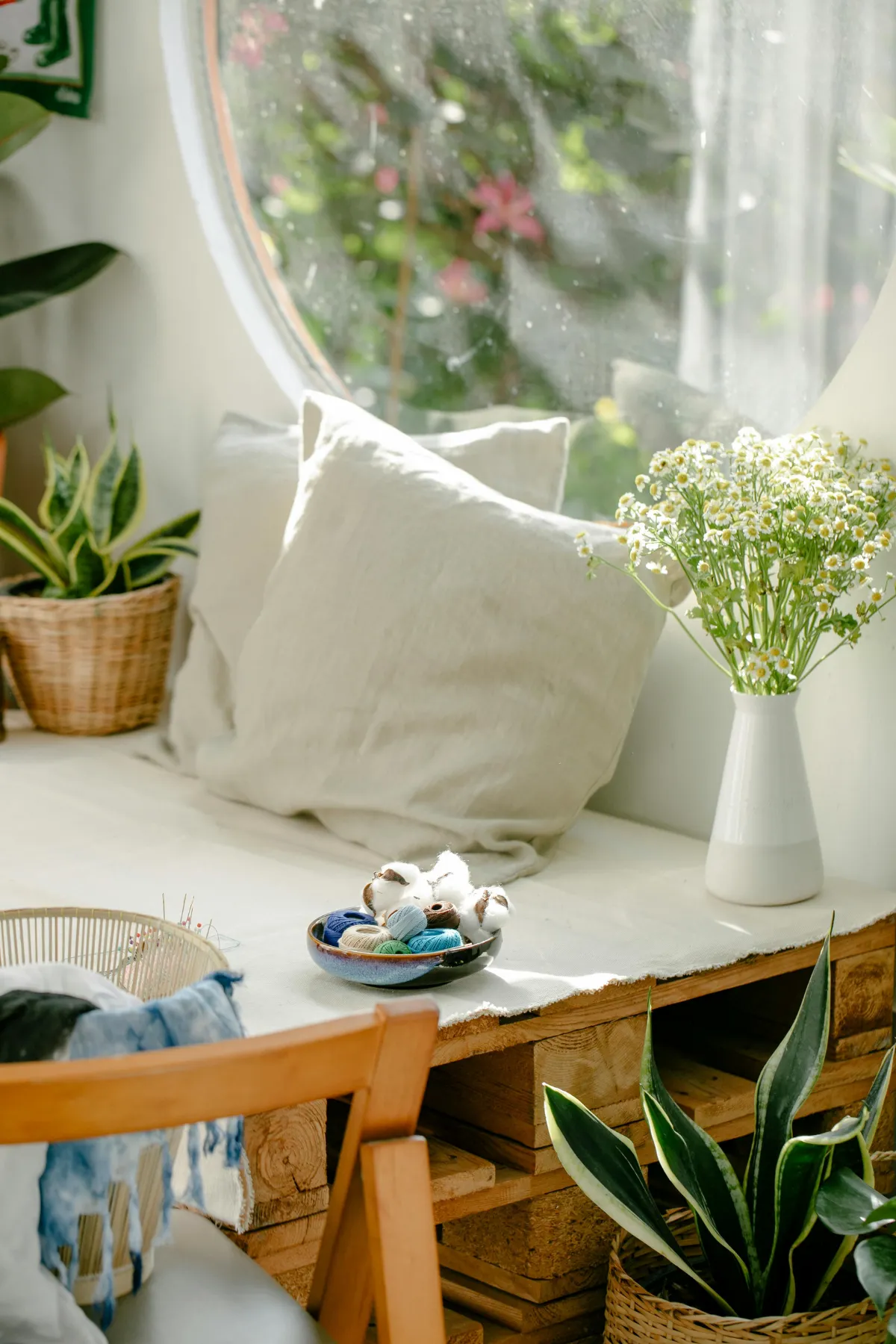 Comfortable seat with while pillows, greenery, and fidget toys for nutrition counseling with an eating disorder dietitian