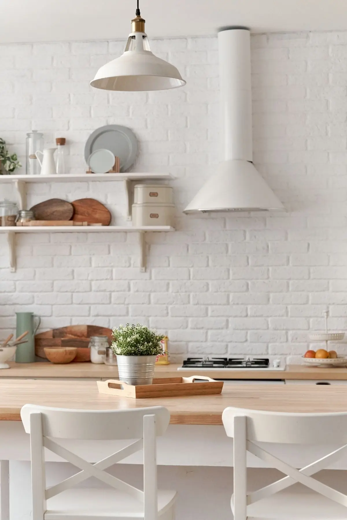 White kitchen with white bar stool seats where a dietitian teachers her nutrition counseling clients about food