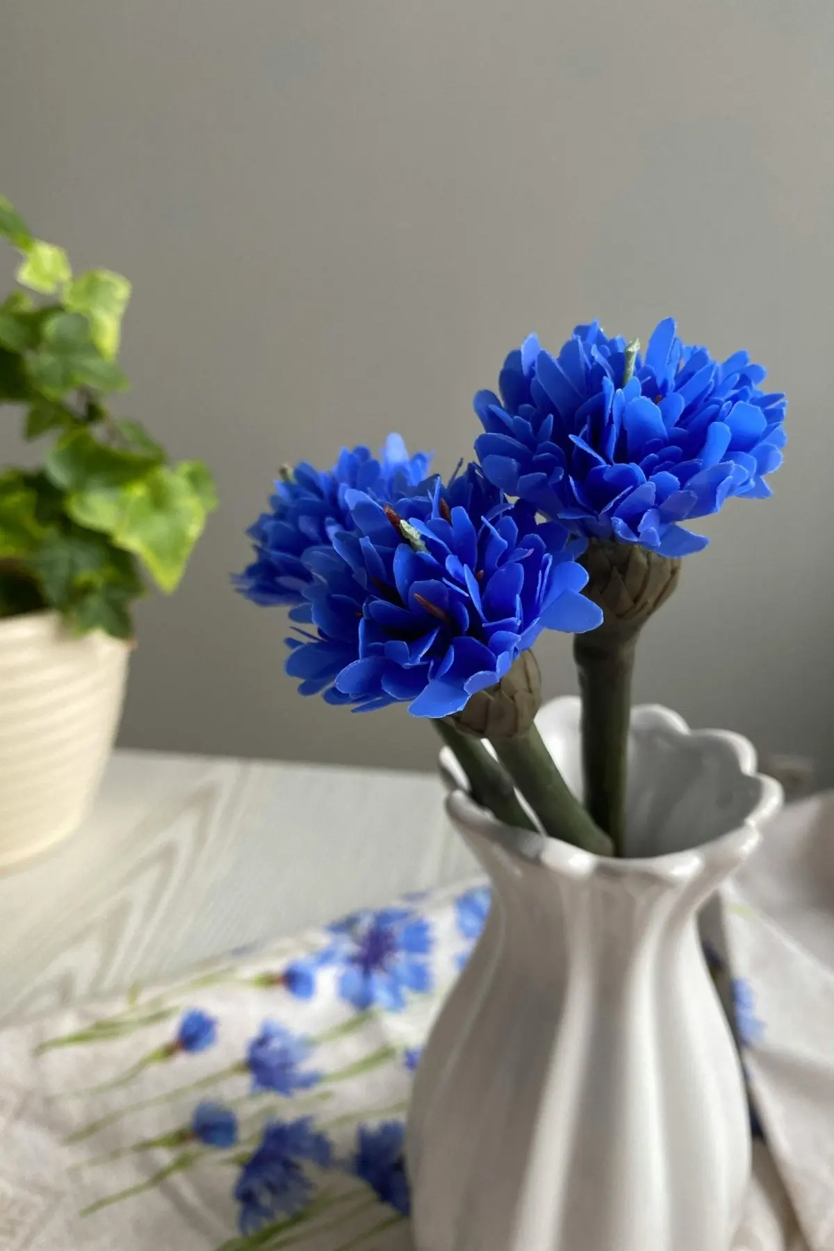 Blue flowers in a vase on a dietitian's desk in Indiana